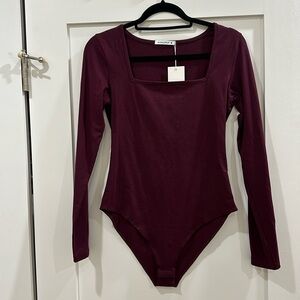 NWT Maroon long sleeved bodysuit